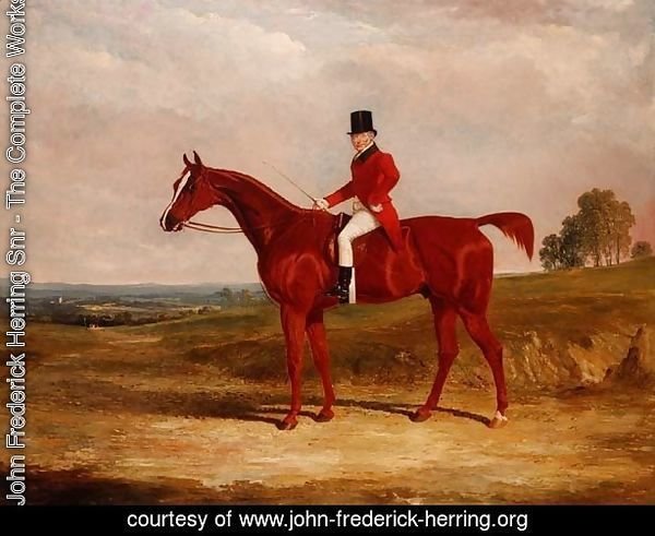 Sir Hugh Hamilton Mortimer, Master of the Old Surrey Foxhounds, on a chestnut hunter in an extensive landscape